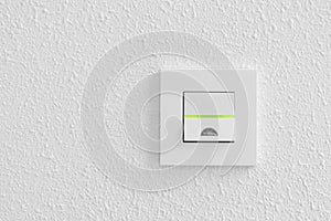 Electrical light switch on white background