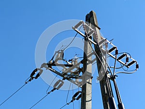 Lectrical line concrete post end piece with cables vertically dropping