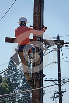 Electrical Linesman on a Telephone Pole