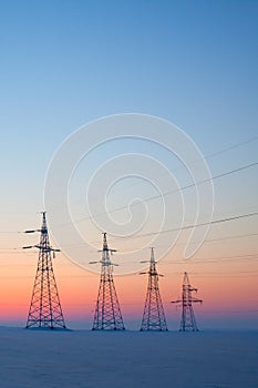 Electrical mast at morning snow