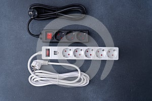 Electrical outlet extension cord. White cable with USB connector for charging phones. Electrical appliance. Extension