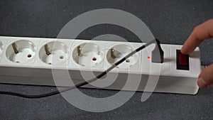 Electrical outlet extension cord. White cable with USB connector for charging phones. Electrical appliance. Extension