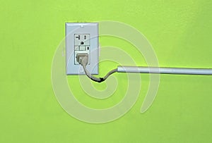 Electrical outlet plate with electric plug