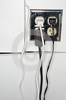 Electrical outlet with plugs.