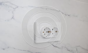 Electrical outlets mounted on wall