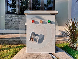 An electrical panel box exposed to morning sunlight