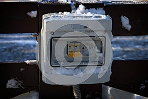 The electrical panel is damaged by snow.