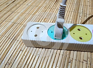 Electrical plug with colored hole markers