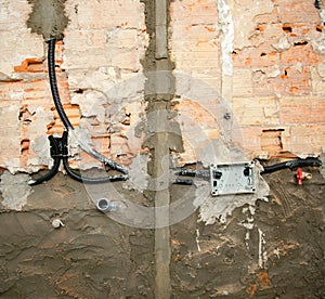 Electrical and plumbing installation in kitchen work