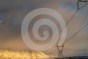 Electrical power lines and towers in desert valley