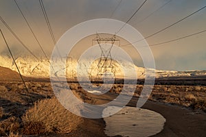 Electrical power lines and towers in desert valley