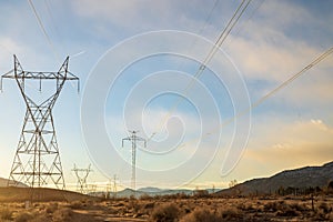 Electrical power lines and towers in desert valley