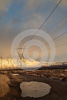 Electrical power lines and towers in desert valley