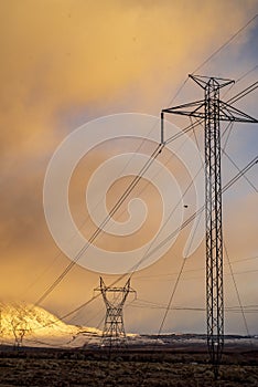 Electrical power lines and towers in desert valley