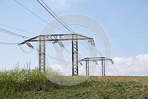 Electrical power lines and towers at sunset.