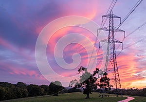 Electrical power lines and towers at sunset.