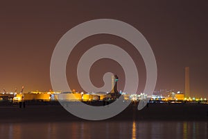 Electrical power plant near sea coat at night, Rayong, Thailand