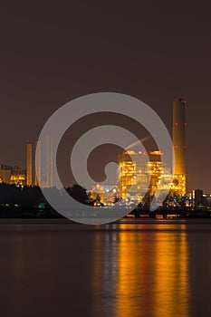 Electrical power plant near sea coat at night, Rayong, Thailand