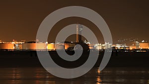 Electrical power plant near the sea coat at night, Rayong, Thailand