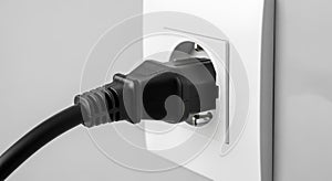 Electrical Power Plug Connected to Wall Socket