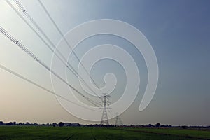 Electrical pylon and high voltage power lines at night