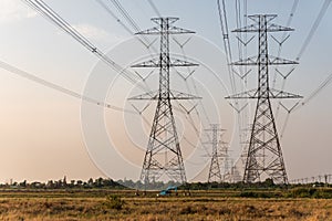 Electrical Pylon Tower in a Paddy Rice Field in Thailand