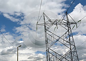 electrical pylons on cloudy sky