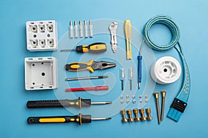 Electrical repair kit tools on blue background