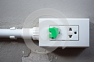Electrical security for safety home of ac power outlet for babies, baby hands playing with electric plug.