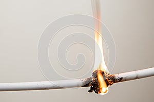 Electrical Short circuit, burnt cable, on white color background