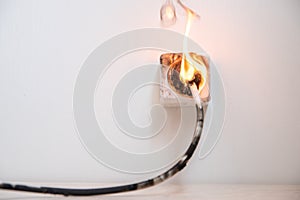 Electrical short circuit. Failure caused by burning wire and rosettes socket plug in house