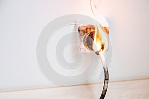 Electrical short circuit. Wiring cable burn on fire flame