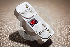 Electrical socket plug adapter.