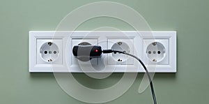 Electrical socket white on four jacks