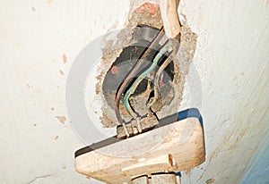 The electrical sockets and switch were loose and hanging off the old walls. visible holes and electrical cables