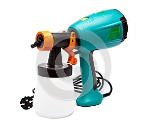 Electrical spray gun for coloration, for color pulverization.Close up in a sunny day