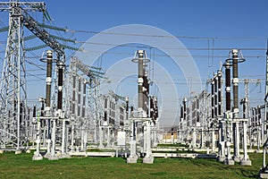 Electrical station. High voltage equipments on power station. Industrial distribution of electricity. High voltage lines