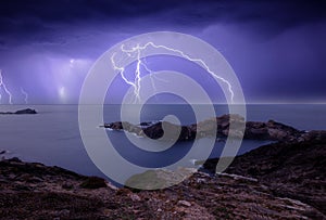 An electrical storm over the sea at sunset