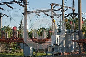 Electrical substation infrastructure with close up on electrical circuit breakers.