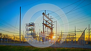 Electrical Substation at Sunset with Blue Sky