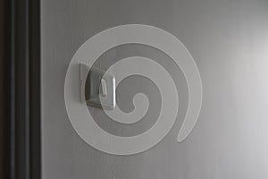 Electrical switch on white wall background