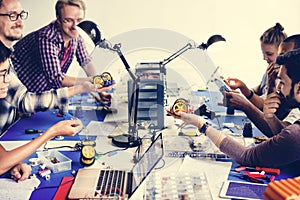 Electrical technicians working on robot electronics parts