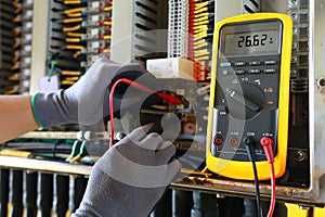 Electrical terminal in junction box and service by technician. Electrical device install in control panel for support program photo