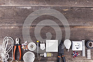 Electrical tools and equipment on wooden background with copy sp