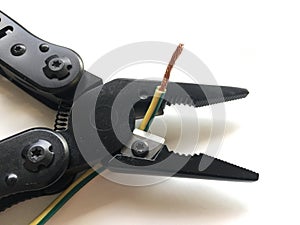 Electrical tools, pliers cut the yellow and green cable