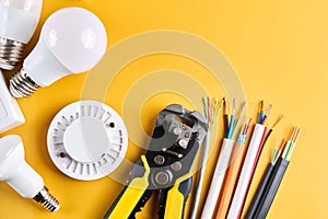 Electrical tools set with dimmer switch isolated on yellow background with copy space, controllable lighting