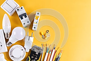 Electrical tools set with dimmer switch isolated on yellow background with copy space, controllable lighting