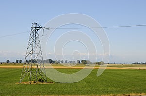Electrical tower among farm fields