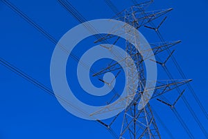 Electrical tower station wiring power with cloudy and blue sky background, High voltage station post