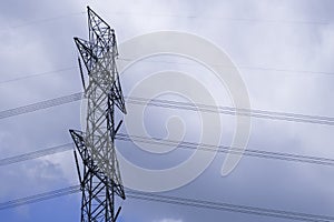 Electrical tower station wiring power with cloudy and blue sky background, High voltage station post